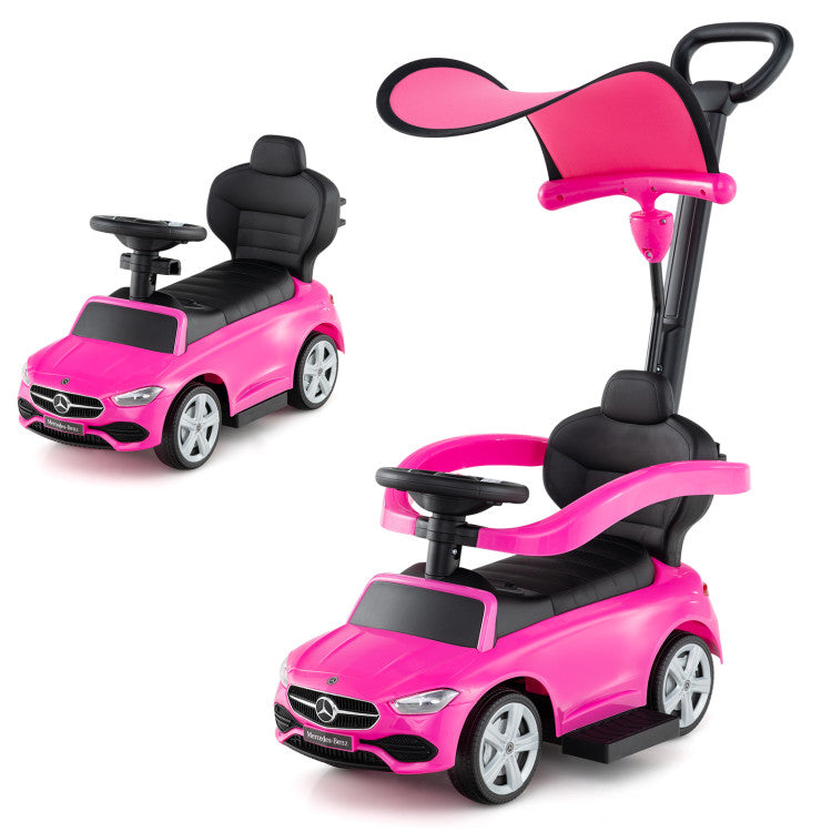 Pink toy car with a seat and handle on a white background