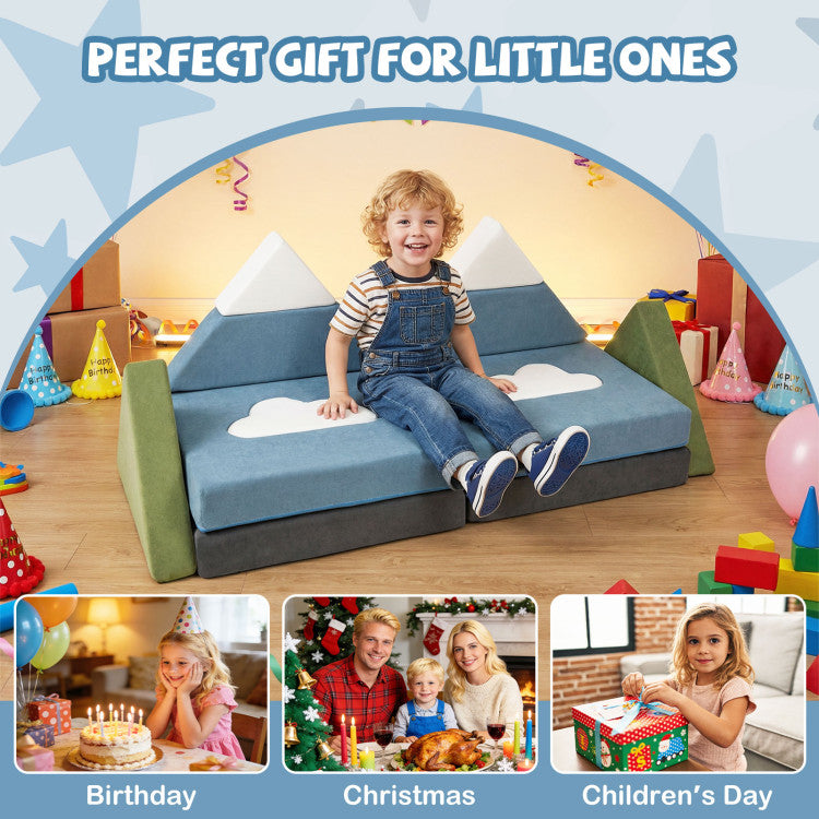 Child sitting on a blue and green play couch with festive decorations and family photos.