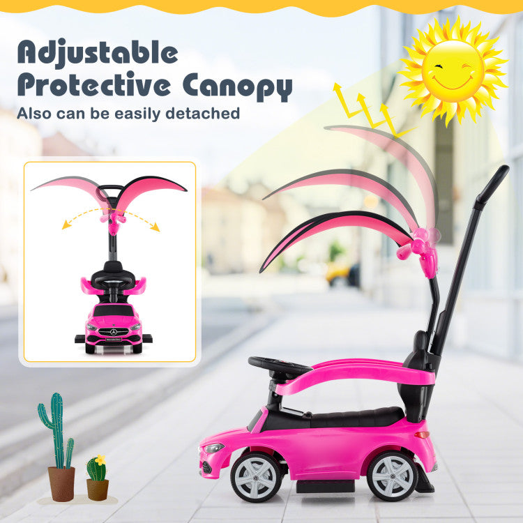 Pink children's push car with adjustable protective canopy in a bright indoor setting.