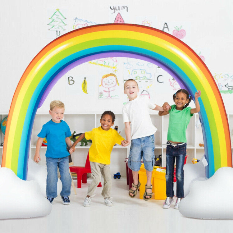 Large inflatable rainbow sprinkler spraying water in backyard