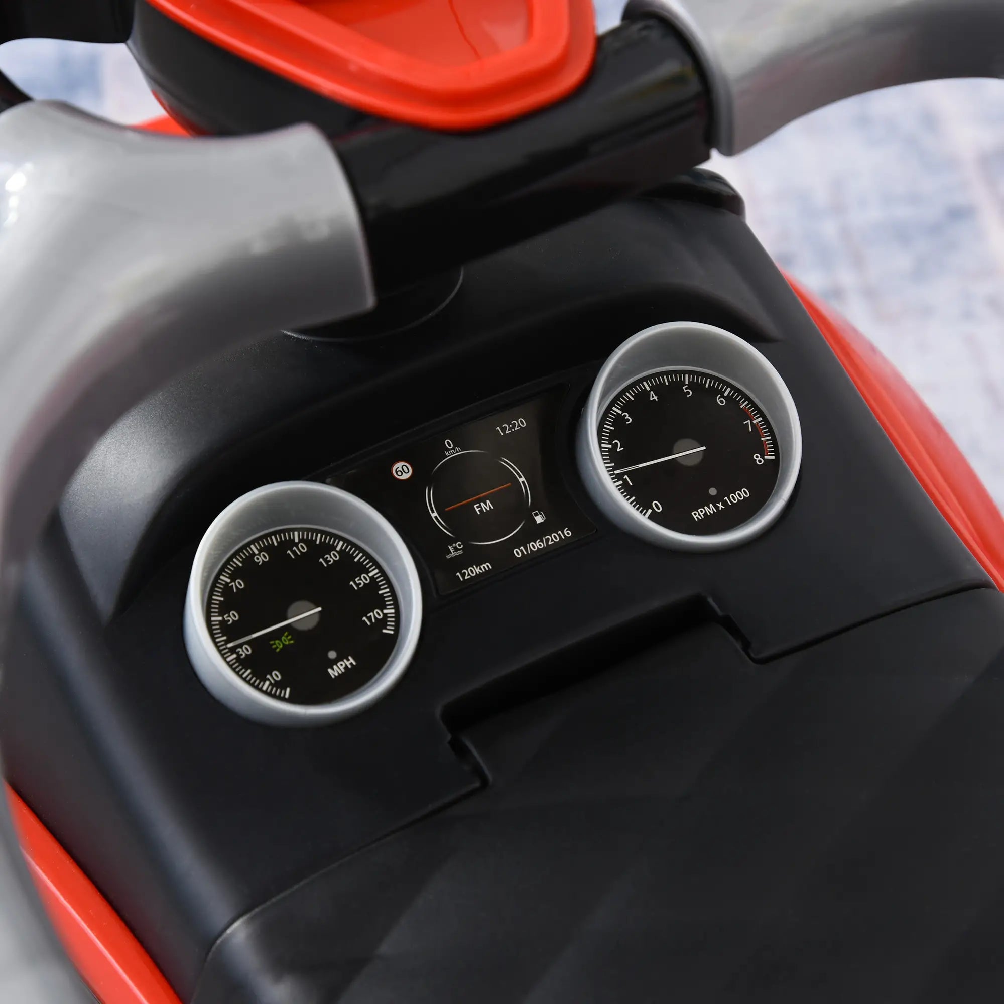 Close-up of a motorcycle dashboard with gauges and controls.