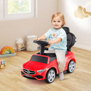 Child playing with a red toy car in a room with toys and a window.