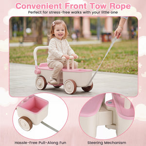 Child riding a pink and beige toy stroller with a front tow rope in a park setting.