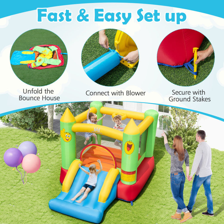 Group of children sliding on outdoor inflatable bounce house.