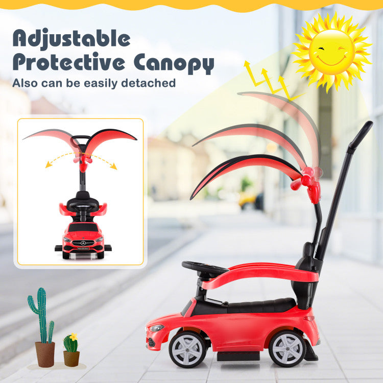 Red children's push car with adjustable protective canopy on a blurred indoor background