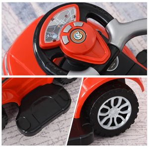 Close-up of a red toy car with steering wheel, dashboard, and wheels on a textured surface.
