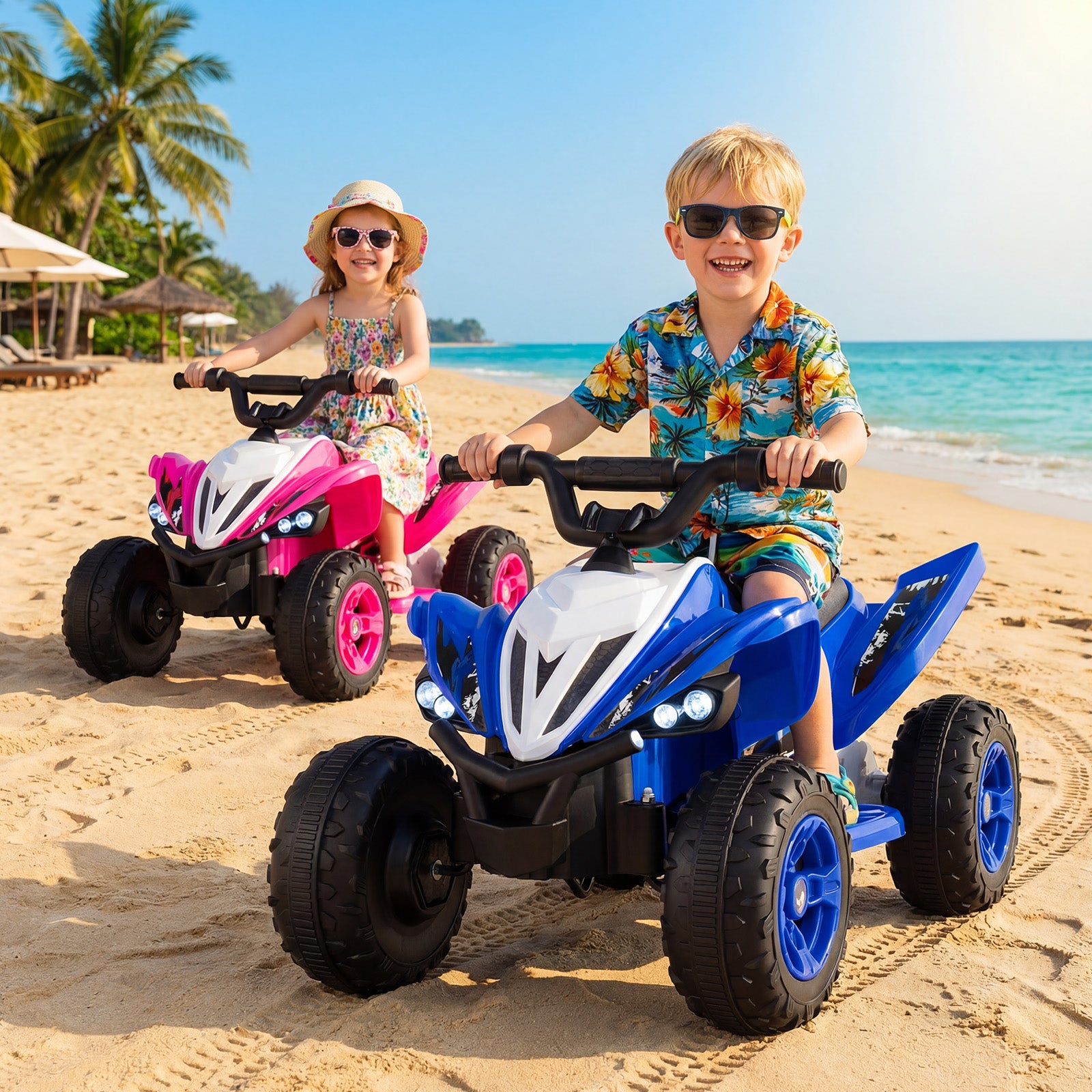 Two children riding toy atvs on a sandy beach with palm trees and ocean in the background.