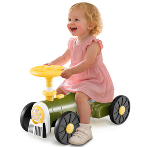 Child playing with a toy car on a white background