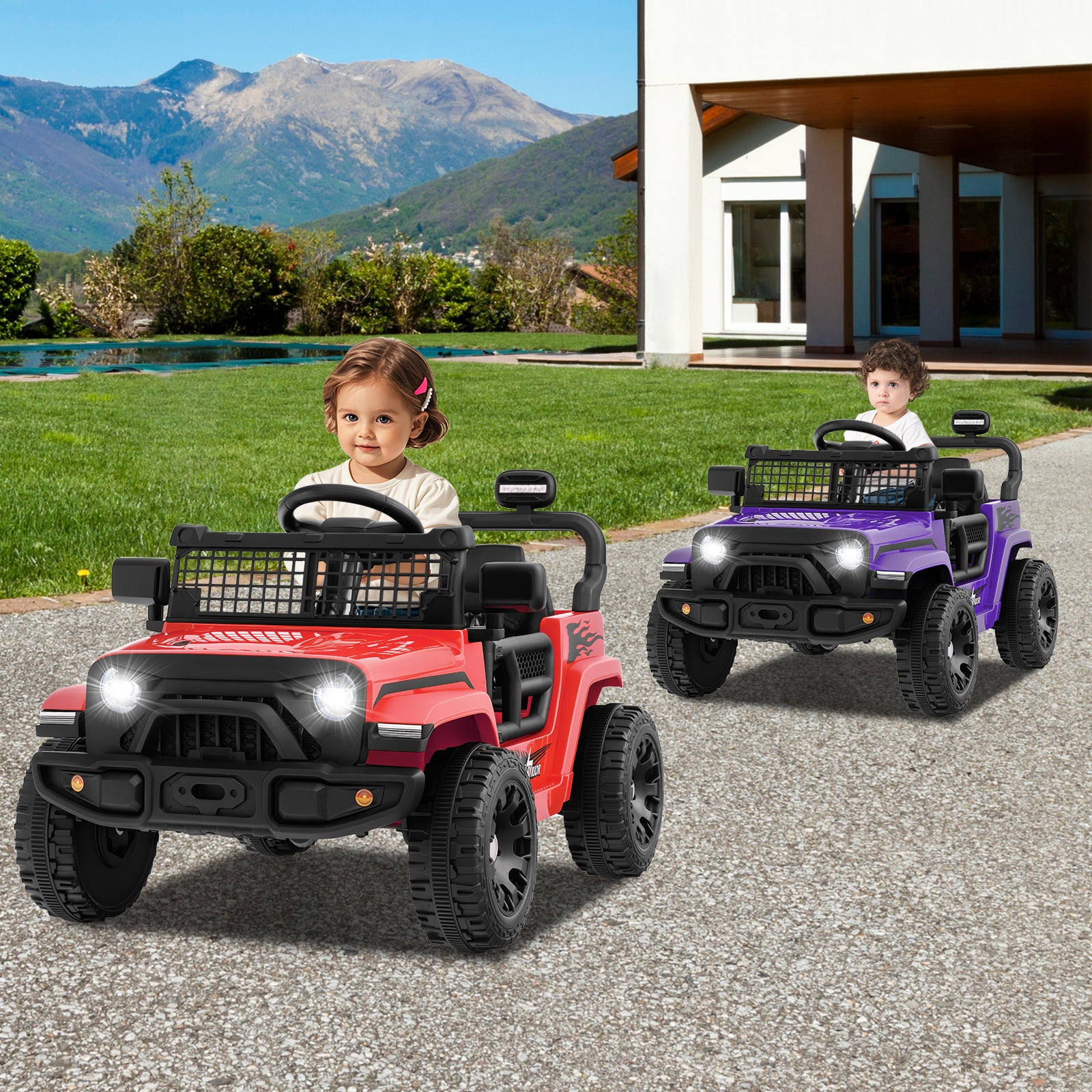 Two children playing with red and purple toy jeeps on a driveway with mountains in the background.