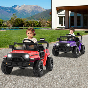 Two children playing with red and purple toy jeeps on a driveway with mountains in the background.