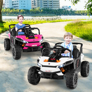 Two children playing with toy cars on a path by a lake.