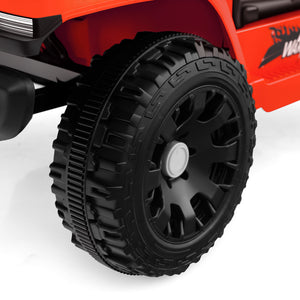 Close-up of a red toy truck with a black tire on a white background