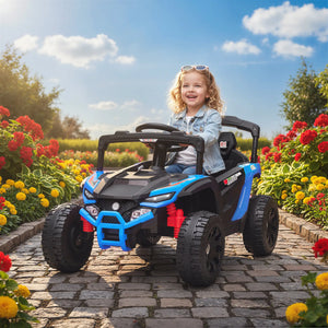 Child sitting in a blue and black toy car on a stone path with flowers and trees in the background