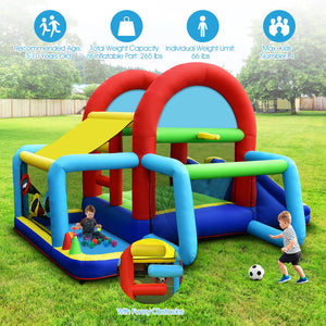 Colorful inflatable playground with slide and climbing structure on grass, children playing nearby.