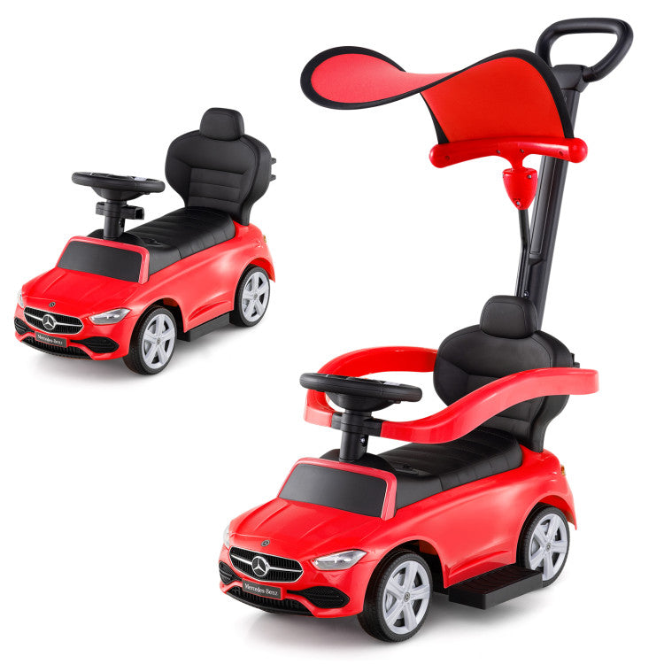 Red toy car with a handle on a white background