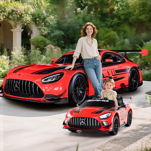 Woman and child with a red Mercedes-Benz car and a smaller model car in a garden setting