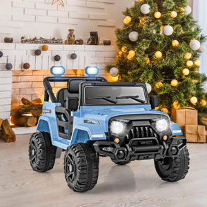 Toy truck with lights in a room decorated for Christmas.