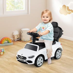 Child playing with a toy car in a room with toys and a window.