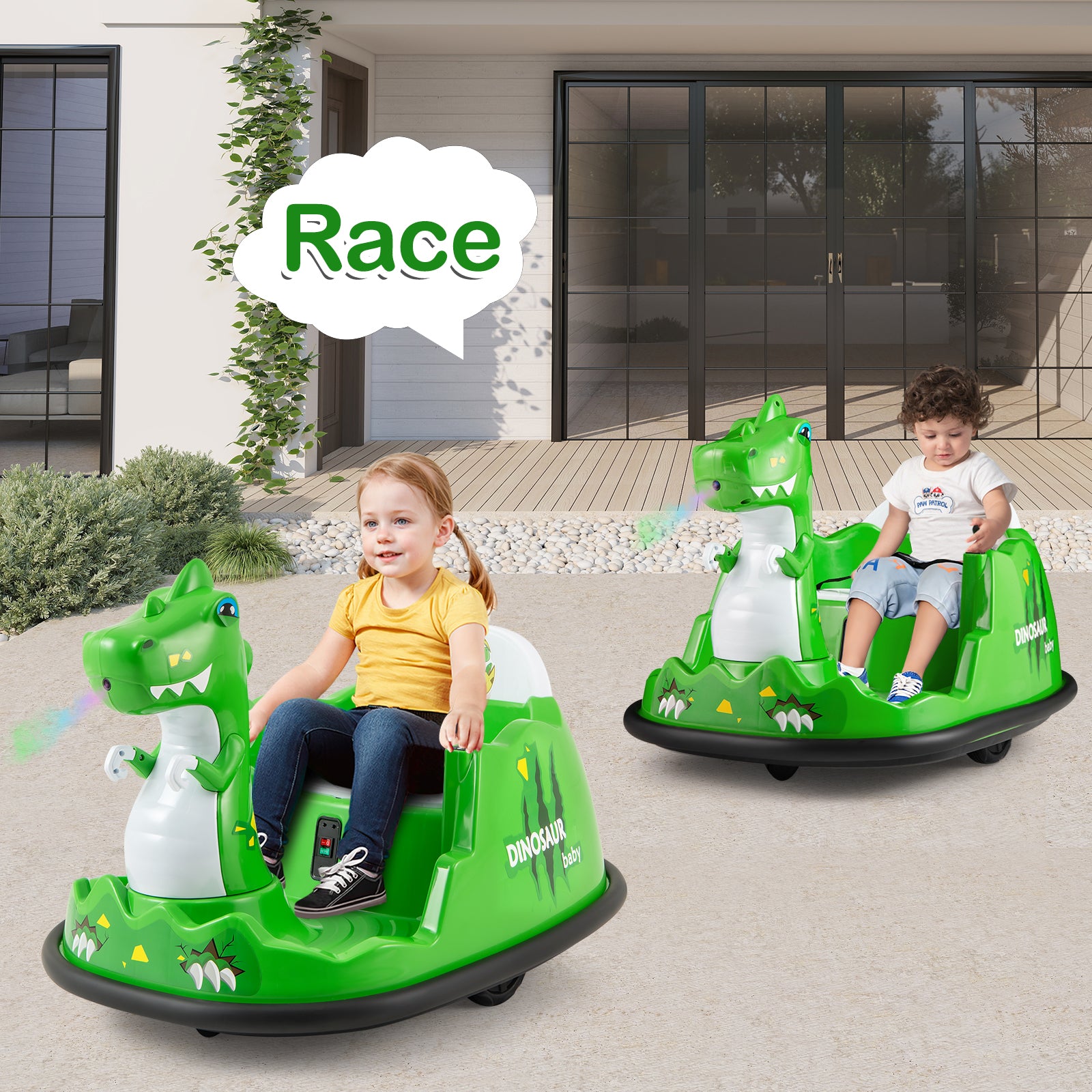 Two children sitting in green toy cars with dinosaur designs on a patio.