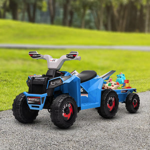 Blue toy ATV with a trailer carrying toys on a gravel path with grass and trees in the background