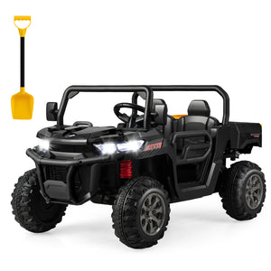 Black toy off-road vehicle with a yellow shovel on a white background