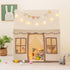 Large toddler playhouse with glowing star string lights