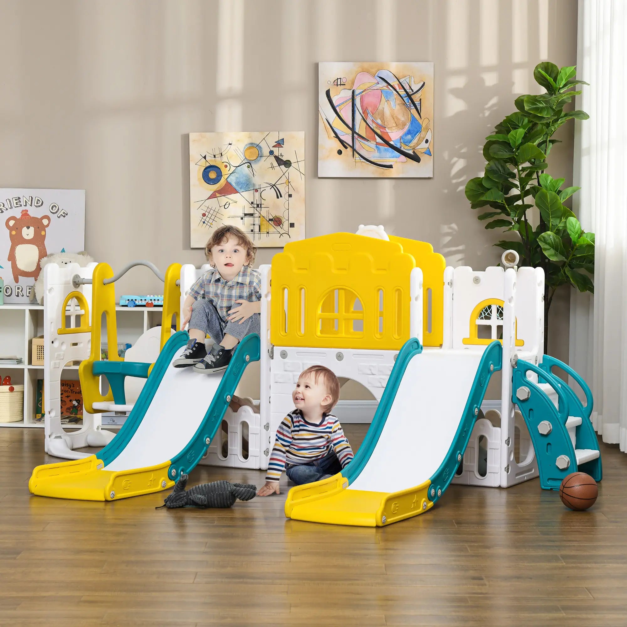 Children playing with a colorful indoor playset in a room with abstract art on the wall.