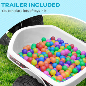 White toy wagon filled with colorful balls on grass, with text 'Trailer Included' above.