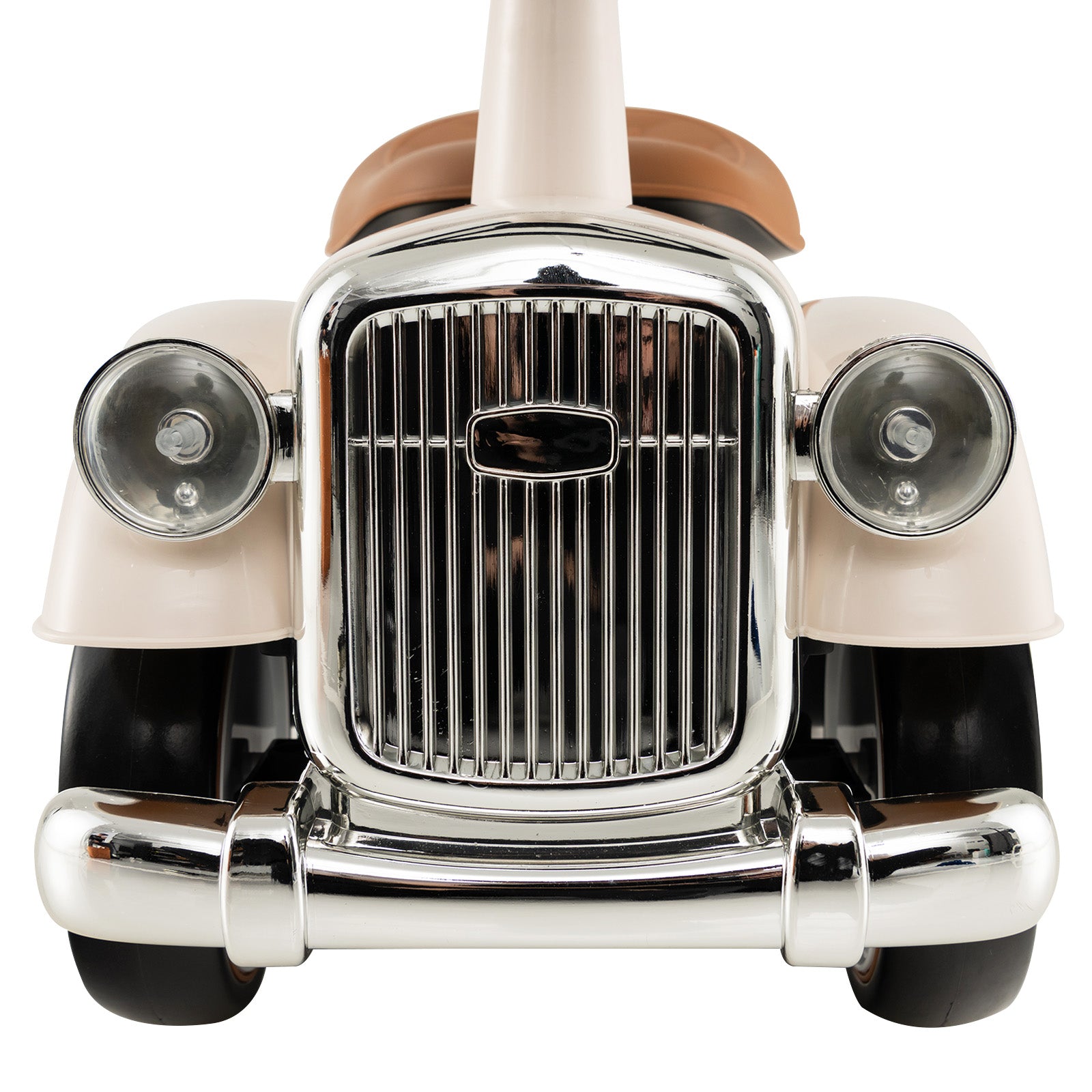 Close-up of a vintage car grille with chrome details on a white background