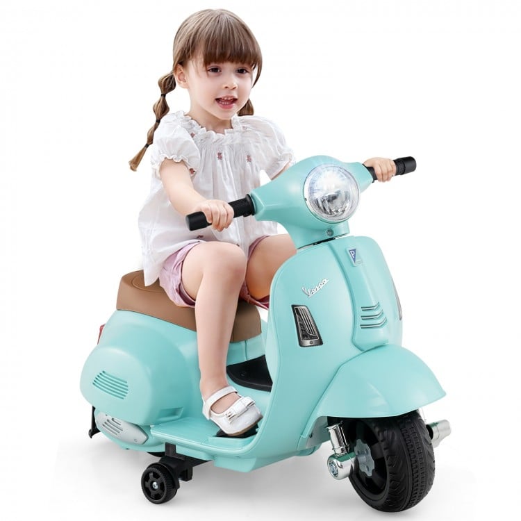 Child riding green electric motorbike