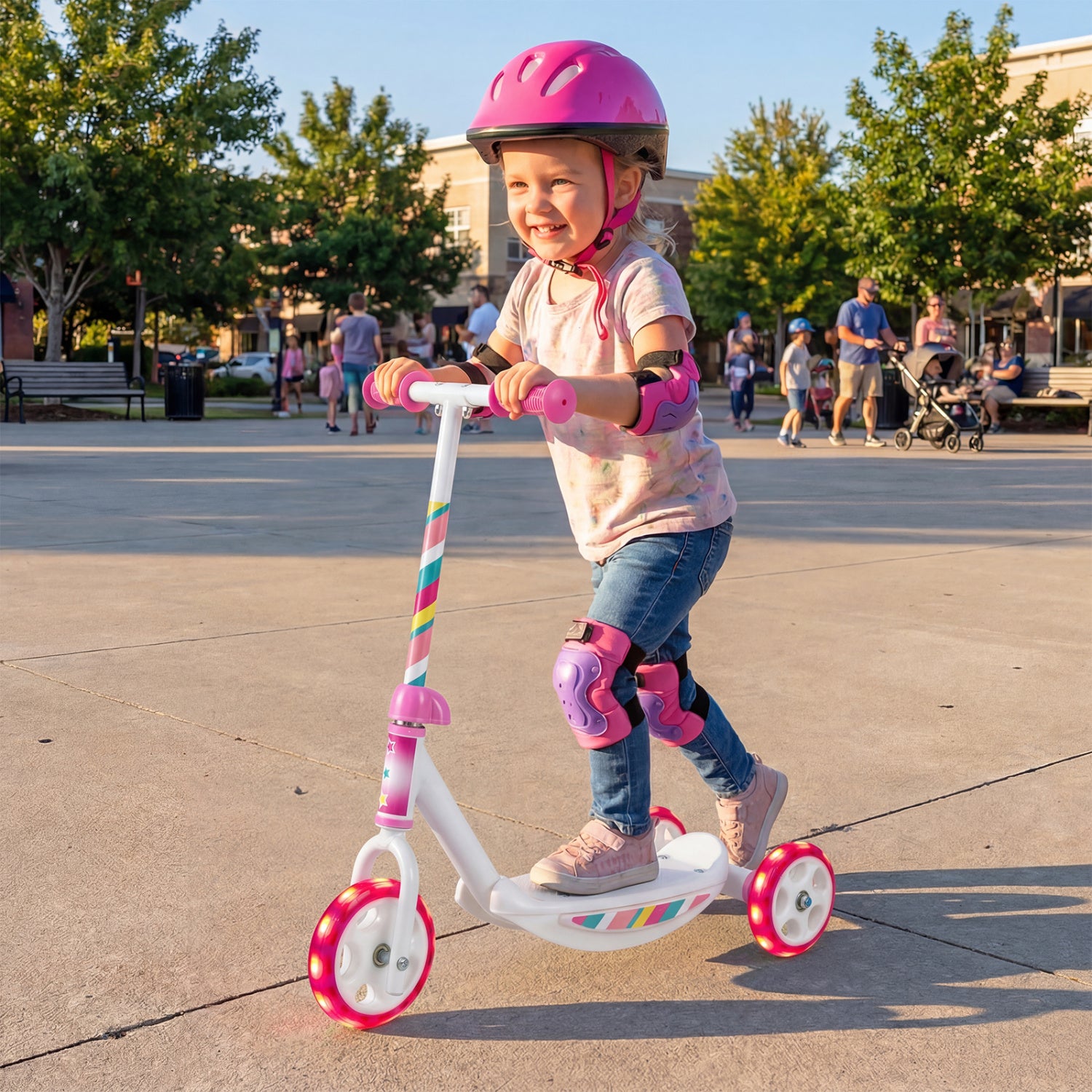 Child riding a scooter with safety gear in an outdoor setting