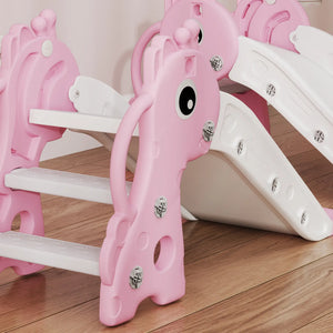 Pink children's slide with a cartoon face on a wooden floor
