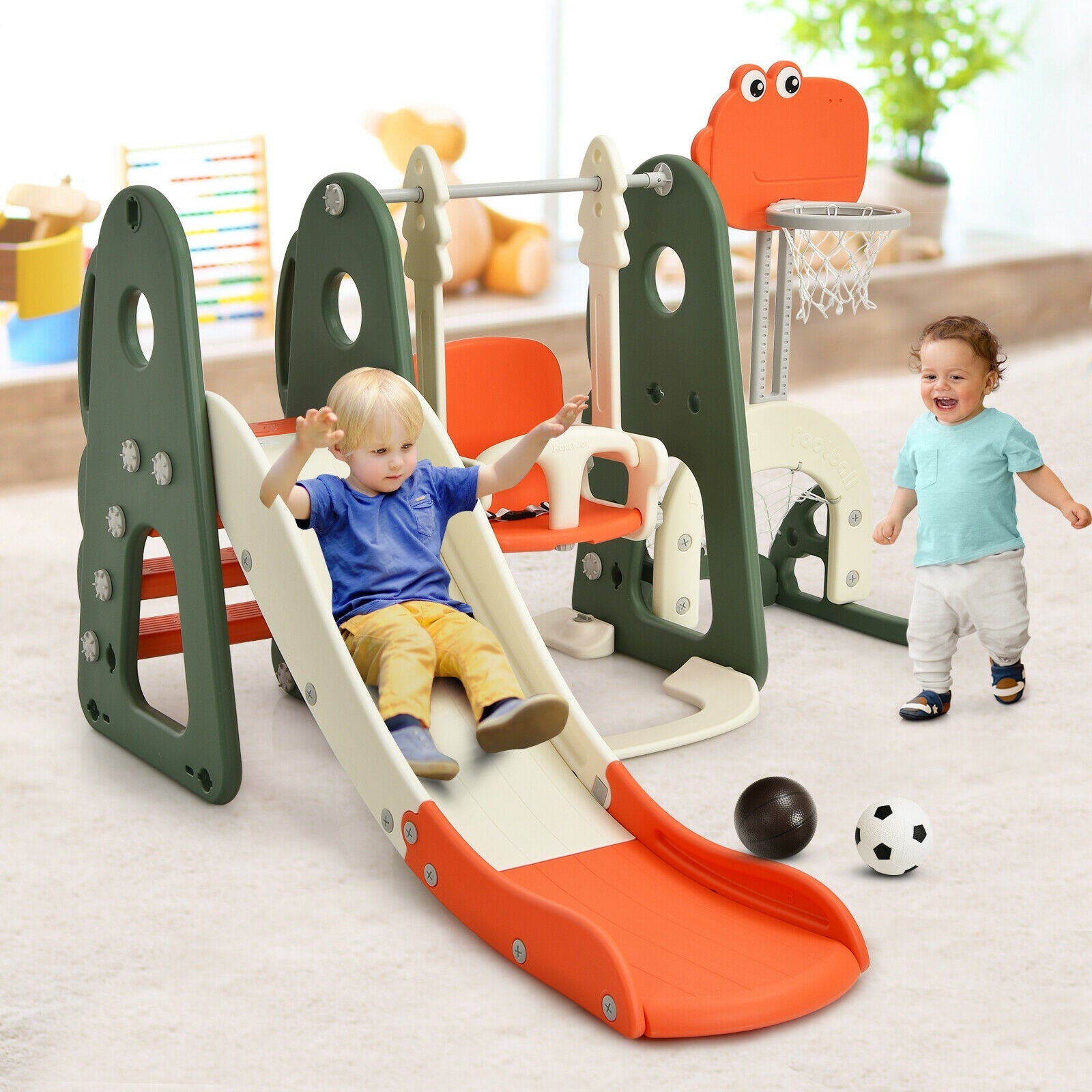 Children playing on a colorful indoor playground set with a slide and climbing structure.