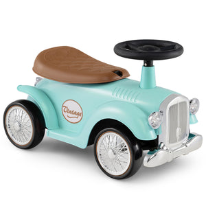 Vintage-style toy car with a brown seat and black steering wheel on a white background