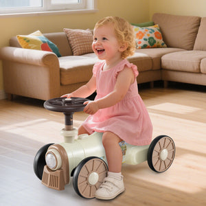 Child playing with a toy car in a living room