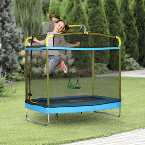 Child playing on a blue trampoline with safety net in a garden