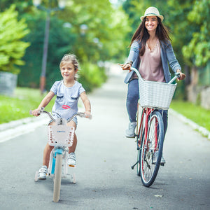 Woman and child riding bicycles on a sunny day