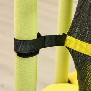 Close-up of a black strap securing green and yellow pool noodles against a neutral background