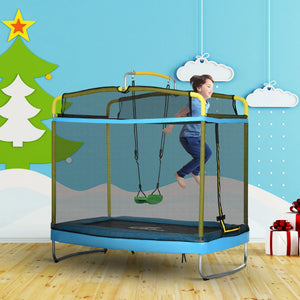 Child playing on a trampoline with safety net in a room with festive decorations.