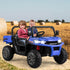 Two children sitting in a blue toy off-road vehicle in a field with hay bales.