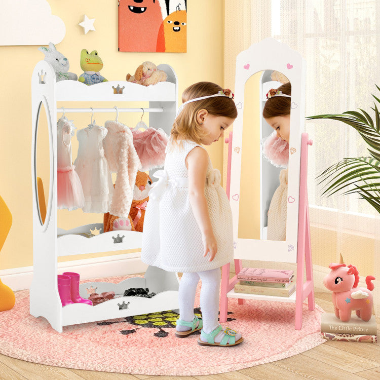 Child playing with a toy wardrobe and mirror in a room with colorful decor.