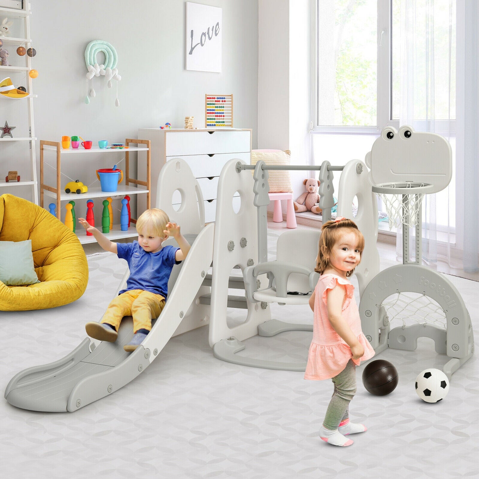 Children playing on a playground set in a bright, modern playroom.