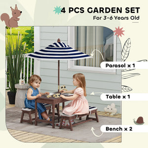 Children's garden set with table, benches, and parasol on a patio.
