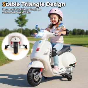 Child riding a toy scooter with stable triangle design and removable training wheels, outdoors.