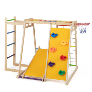 Side view of wooden indoor jungle gym with slide and monkey bars