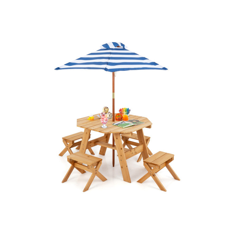 Wooden children's picnic table with chairs and a blue and white striped umbrella on a white background