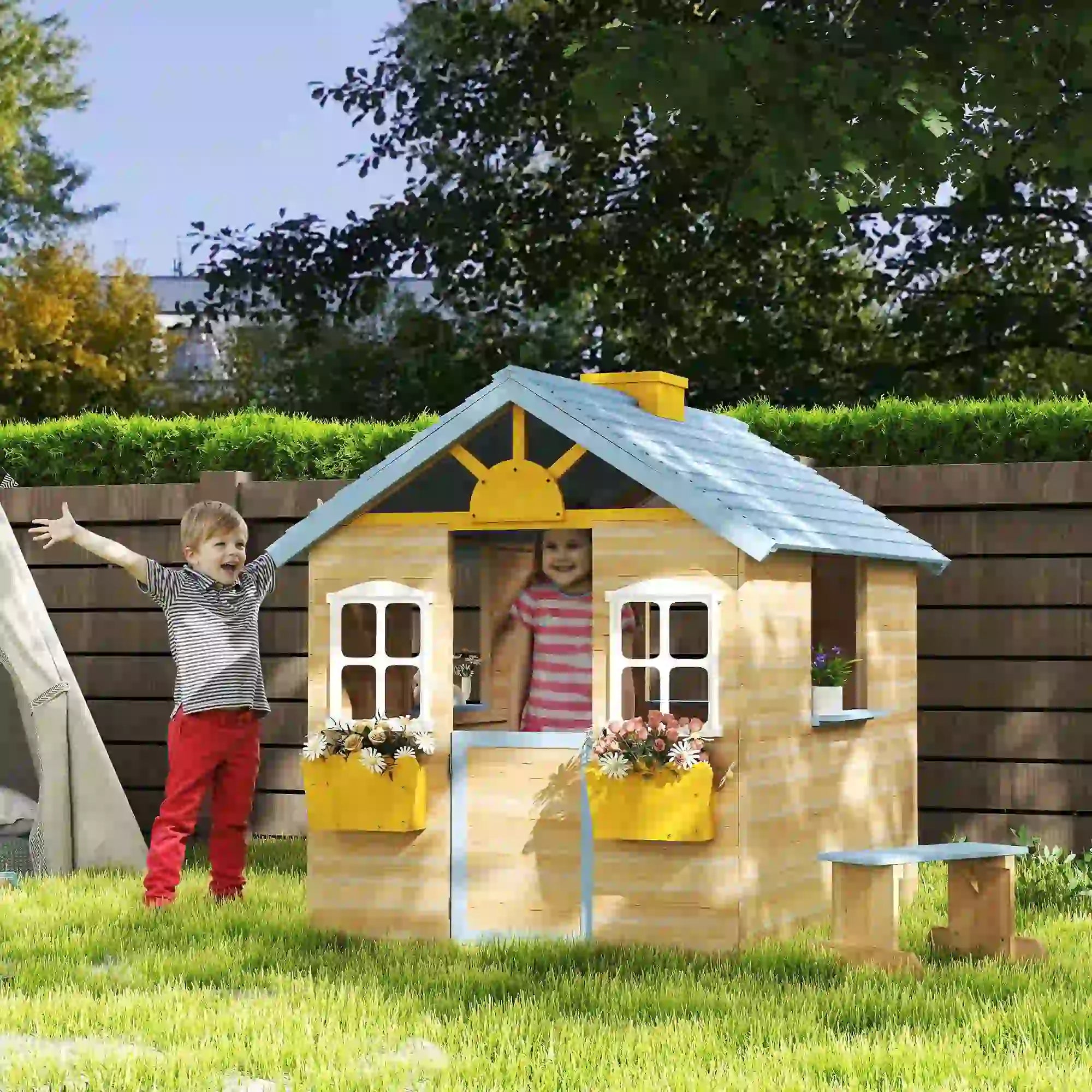 Wooden playhouse with blue roof and bench