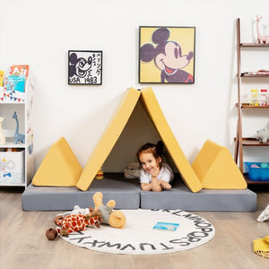 Yellow modular play couch with triangular pillows